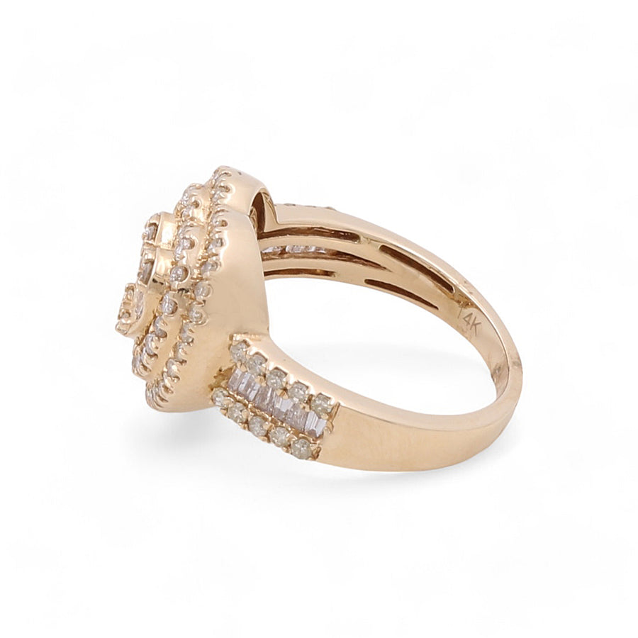 The 14K Yellow Gold Fashion Heart Diamond Women's Ring by Miral Jewelry is crafted with an intricate design and multiple embedded diamonds, beautifully showcased from a side angle against a white background.