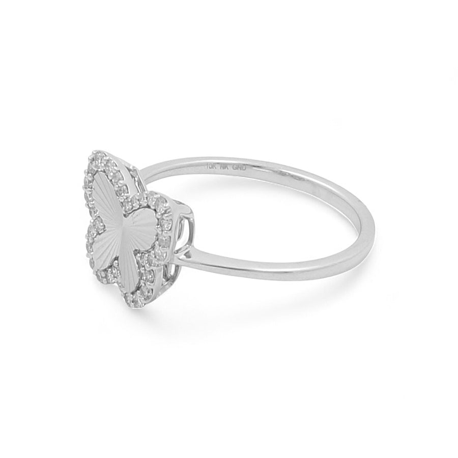 The Miral Jewelry 10K White Gold Fashion Butterfly Diamond Women's Ring is a stunning piece that features a delicate butterfly-shaped design encrusted with small diamonds along the edges, making it a charming addition to women's jewelry.