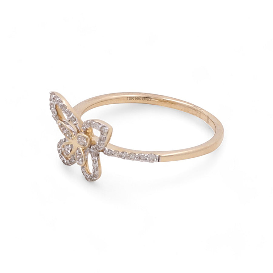 Elegant jewelry at its finest, the Miral Jewelry 10K Yellow Gold Fashion Butterfly Diamond Women's Ring presents a butterfly design encrusted with small diamonds on a plain band. This stunning ring embodies both grace and sophistication.