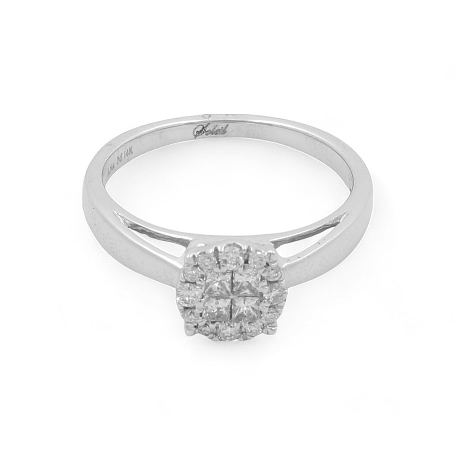 The 14K White Gold Engagement Women's Ring by Miral Jewelry boasts a sleek silver band and a diamond-encrusted circular setting adorned with 0.20Tw round diamonds, offering a contemporary twist on the classic engagement ring.