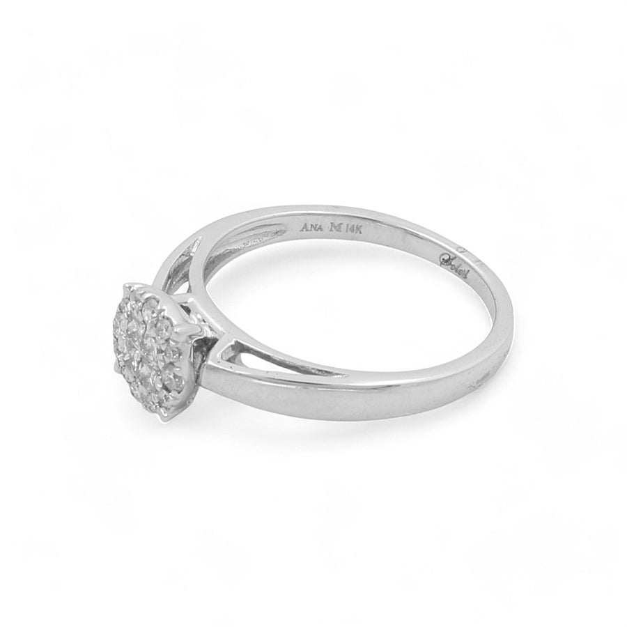 Presenting the Miral Jewelry 14K White Gold Engagement Women's Ring, showcasing a captivating cluster of small round diamonds arranged in a circular setting against a pristine white backdrop.