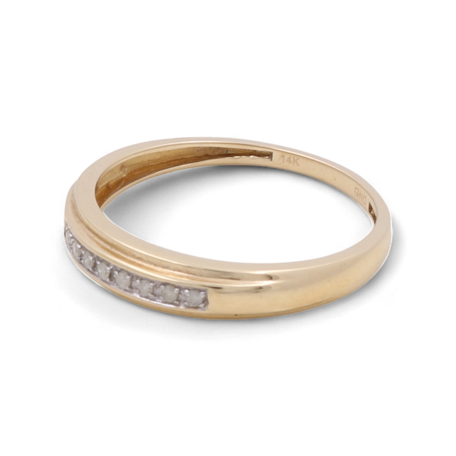 A stunning men's bridal ring crafted in 14K yellow gold by Miral Jewelry, featuring a row of small embedded diamonds on one side. Engraved inside is "14K" and "GMJ".