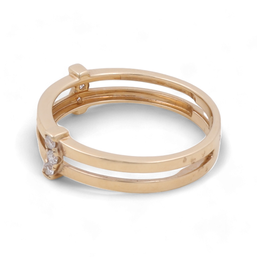 Introducing the 14K Yellow Gold Fashion Diamond Women Ring by Miral Jewelry, featuring a split band design and a delicate clear diamond at the center, perfect for adding a touch of elegance to your fashion jewelry collection.