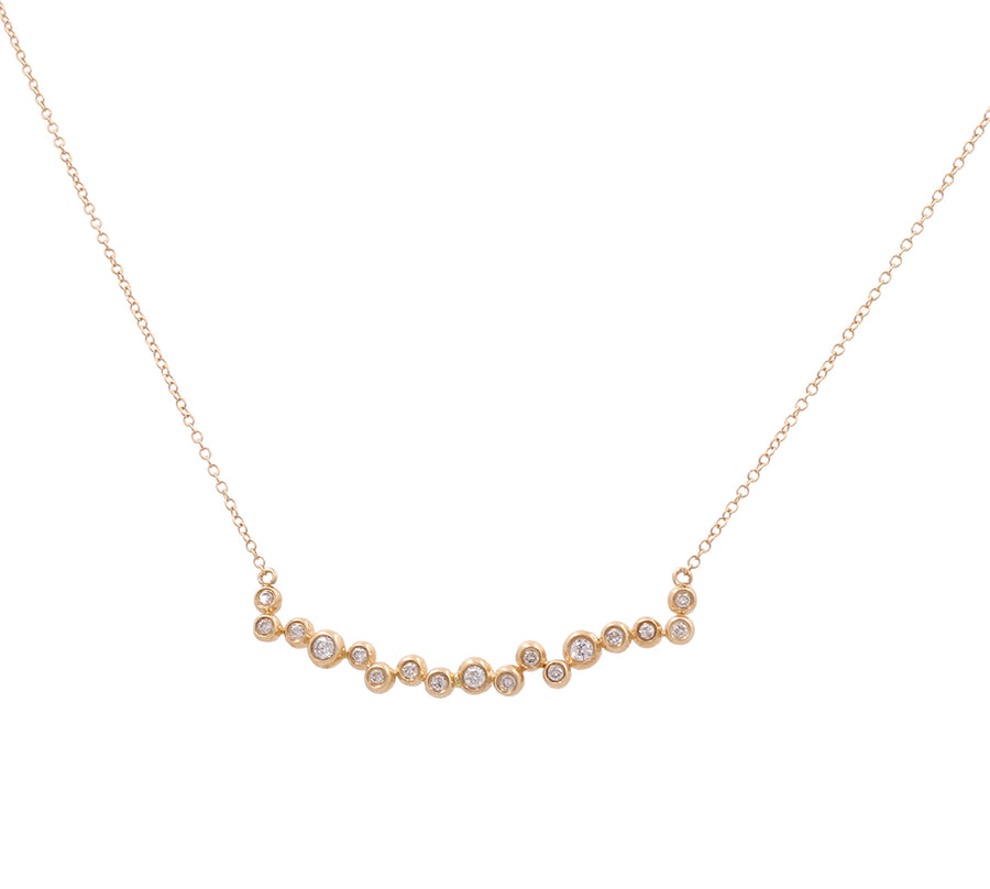 A stunning creation from Miral Jewelry, this 14K Yellow Gold Fashion Diamond Women Necklace boasts a curved arrangement of 13 small round diamonds linked by elegant gold connectors. Perfect for adding an elegant touch to any outfit, this necklace is a timeless treasure.