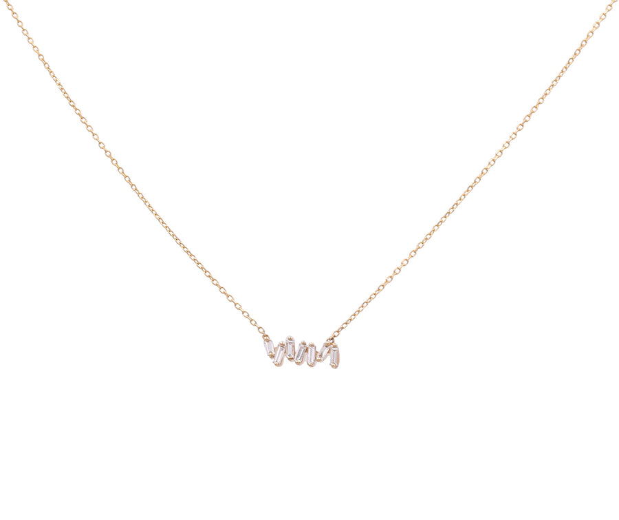 Introducing the 14K Yellow Gold Fashion Diamond Women Necklace by Miral Jewelry, a delicate piece featuring a gold chain with a pendant elegantly spelling "love" in cursive and adorned with small crystals. Crafted from 14K yellow gold, this exquisite necklace adds both charm and sophistication to your collection.