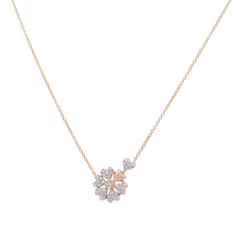 An elegant luxury jewelry piece from Miral Jewelry, the 10K Yellow Gold Fashion Diamond Women's Necklace features a pendant adorned with a cluster of small, sparkling diamonds in a captivating flower shape—ideal for any fashionable diamond women's necklace collection.