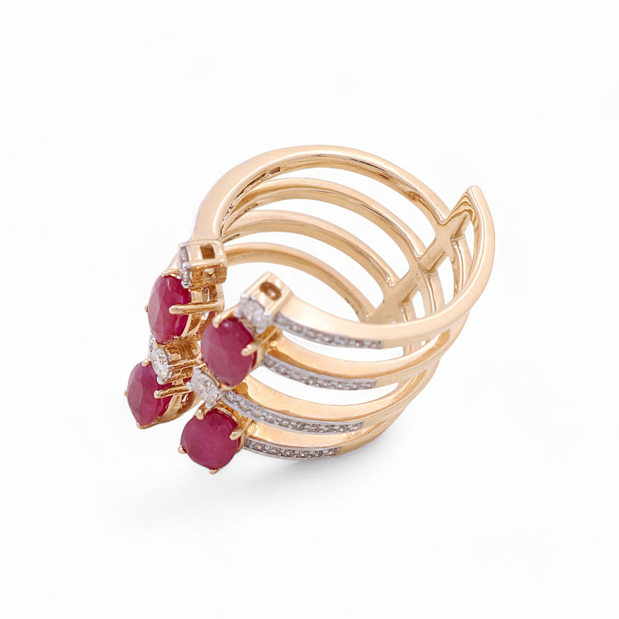 A fashion ring designed by Miral Jewelry, named the 14K Yellow Gold Woman Fashion Ring with Diamonds and Ruby, features five bands adorned with four radiant rubies and small embedded diamonds.