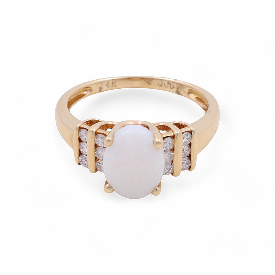 The Miral Jewelry 14K Yellow Gold Woman Fashion Ring with Diamonds and Oval Opals showcases a central oval-shaped opal stone, flanked by three small diamonds on each side, making it a perfect addition to any woman's luxury jewelry collection.