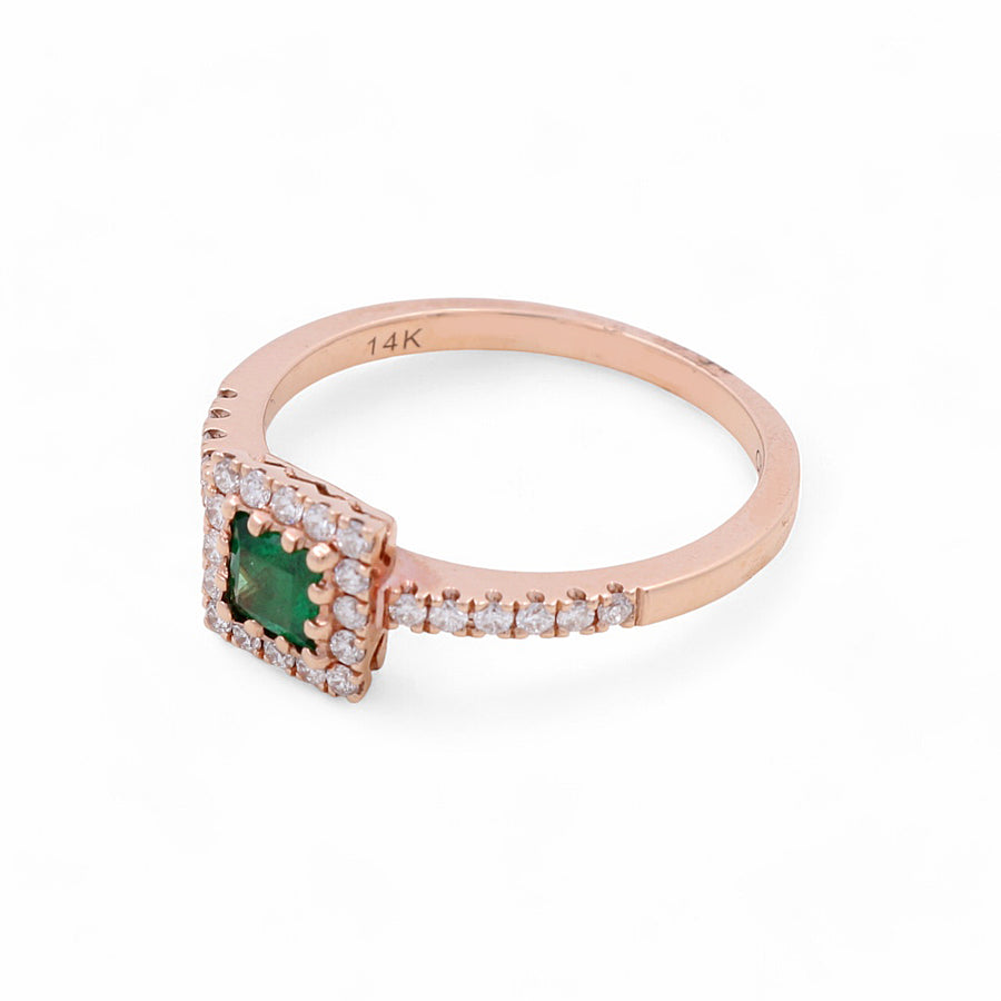 The Miral Jewelry 14K yellow gold fashion ring for women features a stunning square emerald centerpiece, encircled by sparkling diamonds, embodying the essence of luxury jewelry.