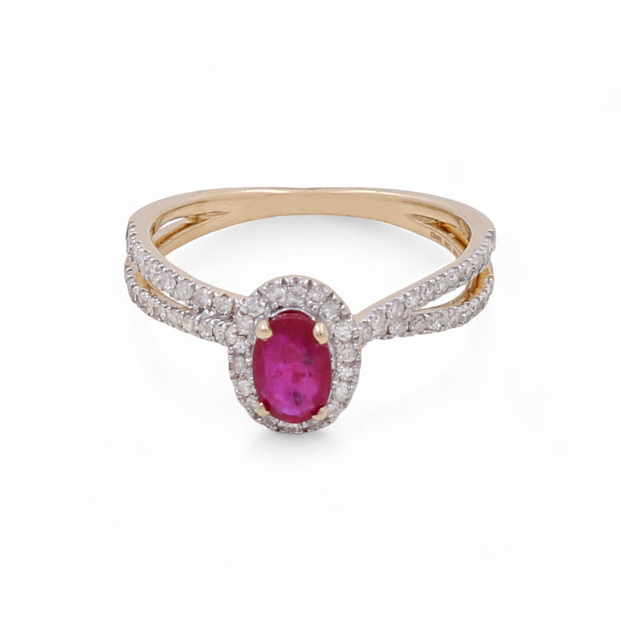 This 14K Yellow Gold Woman Ring by Miral Jewelry features an oval-shaped ruby surrounded by small diamonds, with a split shank design accented with additional clear stones.