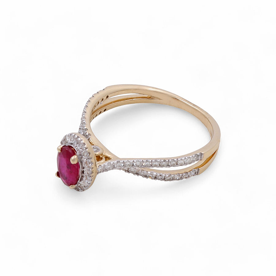 A luxury jewelry piece from Miral Jewelry, this 14K yellow gold woman's ring features an oval ruby surrounded by small white diamonds on a white background.