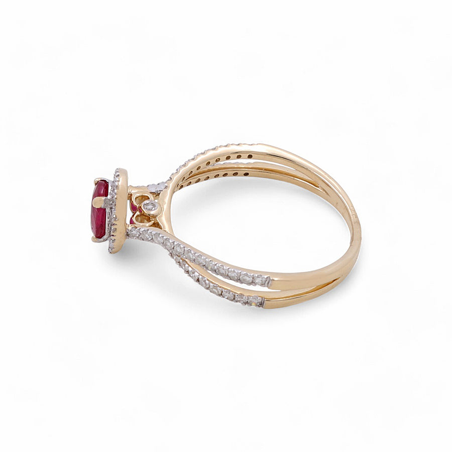 Experience luxury jewelry with the Miral Jewelry 14K Yellow Gold Woman Ring, featuring a vivid ruby gemstone at its heart, complemented by small diamonds encrusted on the band.