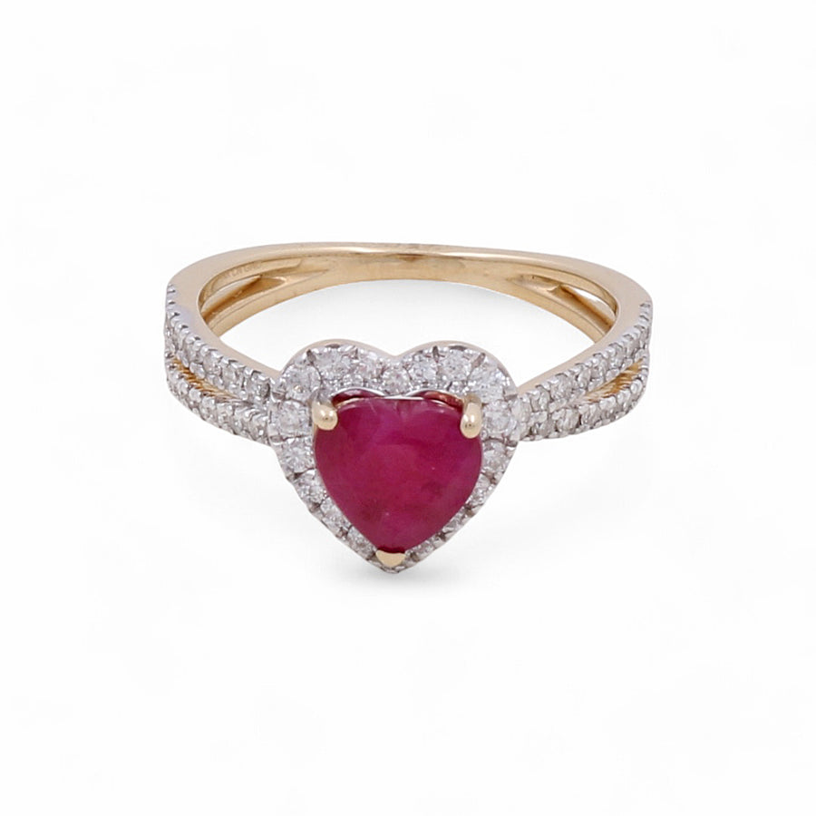 The 14K Yellow Gold Woman Ring with Diamonds and Heart Ruby by Miral Jewelry is a stunning addition to any woman's jewelry collection, featuring a heart-shaped ruby encircled by sparkling diamonds and an exquisite double band adorned with elegant diamond accents.