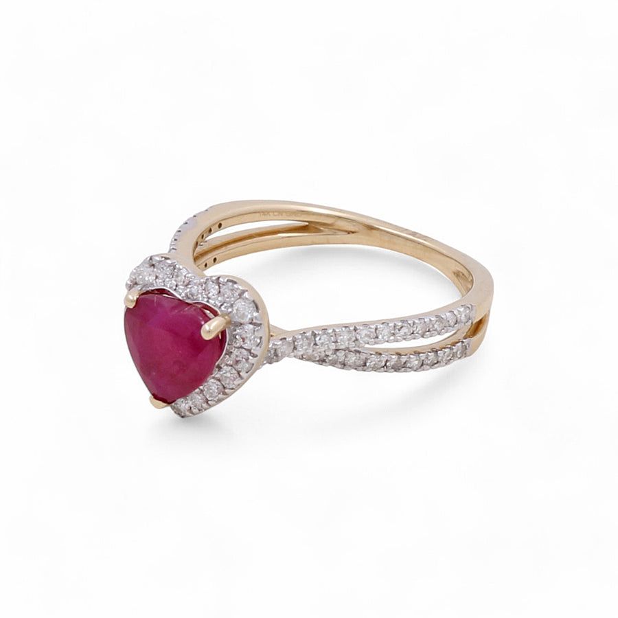 The Miral Jewelry 14K Yellow Gold Woman Ring, featuring a heart-shaped ruby at the center surrounded by dazzling diamonds and a split shank design, is an exquisite piece of jewelry.