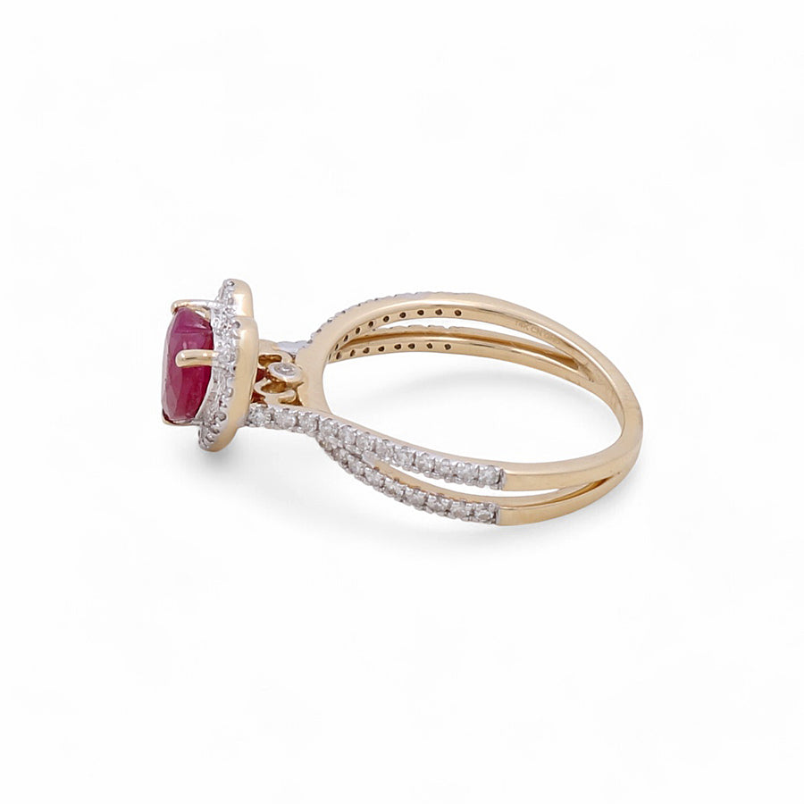 The Miral Jewelry 14K Yellow Gold Woman Ring with Diamonds and Heart Ruby highlights a dazzling heart-shaped ruby set in the center, secured by prongs, with a band embellished with small white diamonds on both sides, exemplifying exquisite craftsmanship in women's jewelry.