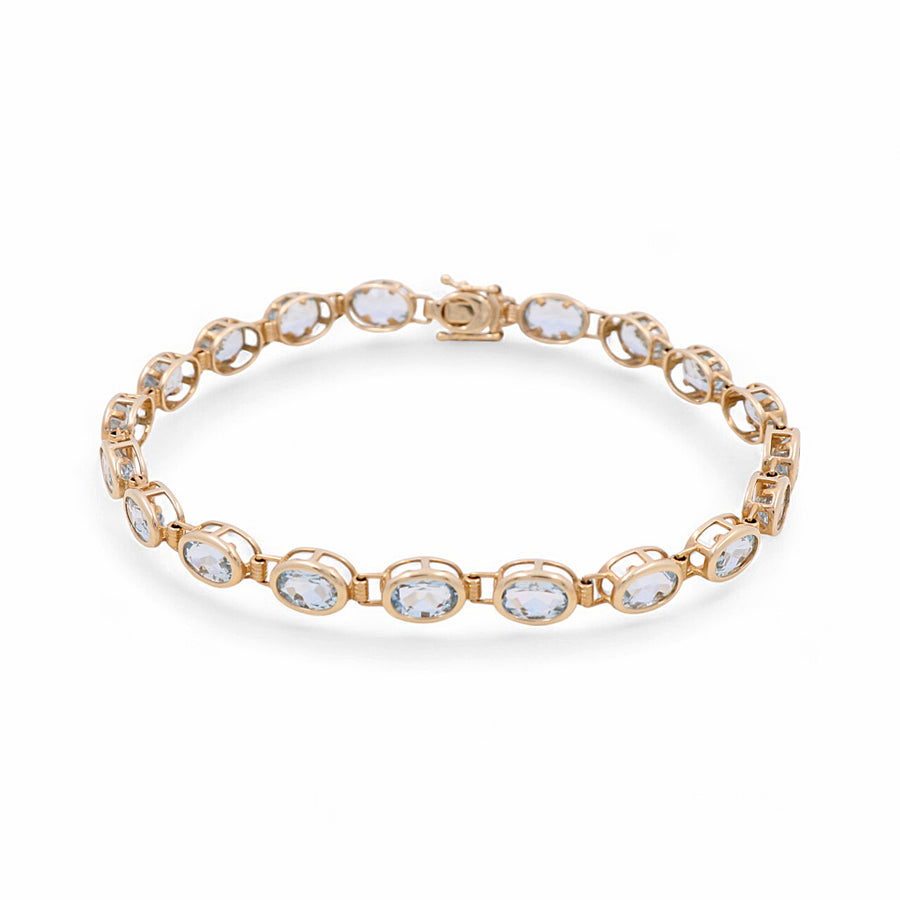 Miral Jewelry's 14K yellow gold bracelet features a series of oval-shaped aqua gemstones linked together, enhanced by sparkling cubic zirconias.