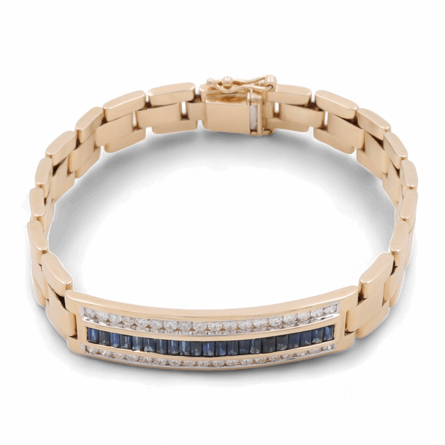 A 14K Yellow Gold Fashion Italian Bracelet with Diamonds and Sapphires by Miral Jewelry features a rectangular section adorned with blue and clear gemstones, while Greek and Cuban links add an extra touch of elegance to this fashionable piece.