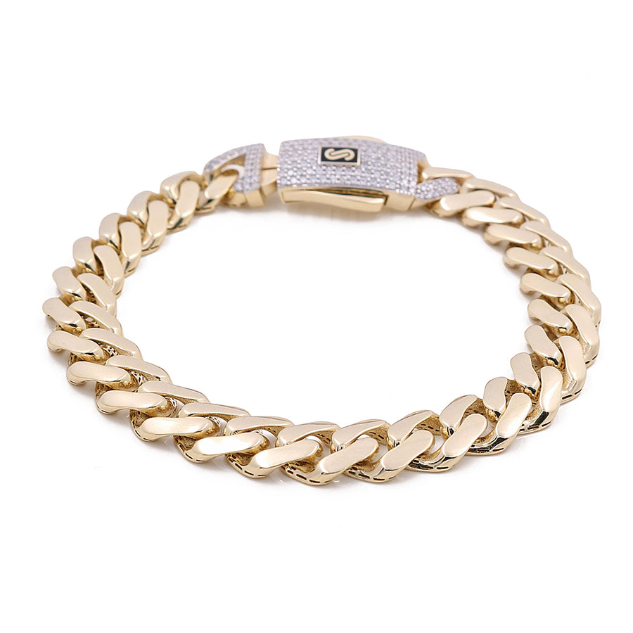 The Miral Jewelry 14K Yellow Gold Monaco Bracelet is an exquisite luxury piece designed with a gold chain link pattern and a rectangular clasp adorned with small stones.