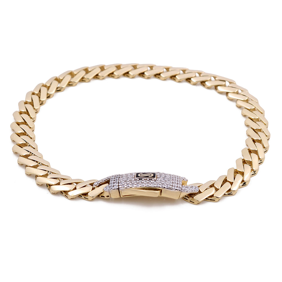 Experience the captivating elegance of the 14K Yellow Gold Men's Monaco Bracelet by Miral Jewelry. Featuring a decorative clasp, this exquisite Cuban link bracelet is the pinnacle of luxury, ideal for enhancing any outfit with its refined charm.