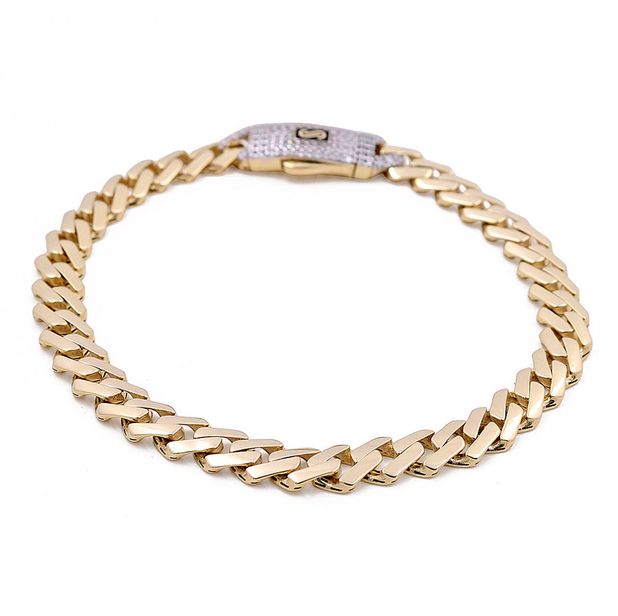 Indulge in timeless elegance with the 14K Yellow Gold Men's Monaco Bracelet by Miral Jewelry. This luxurious accessory, displayed against a white background, boasts a sophisticated clasp for refined style.