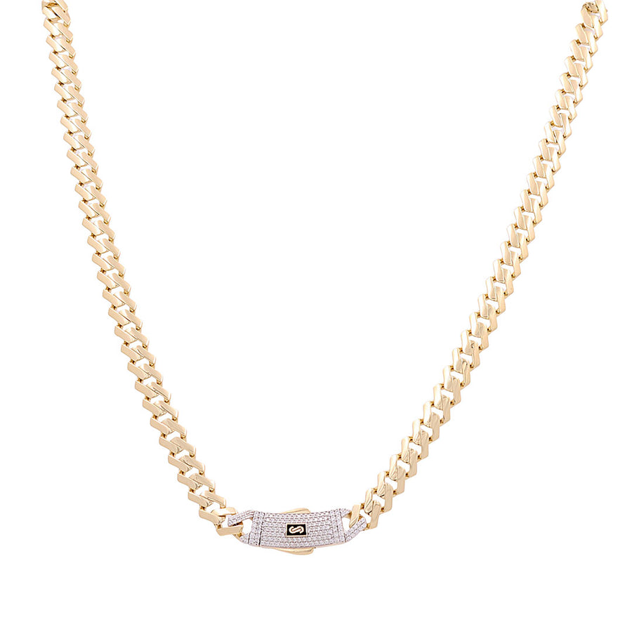 The 14K Yellow Gold Monaco Chain 20" by Miral Jewelry features a decorated clasp centerpiece, adding a touch of elegance. Crafted in genuine gold, this design ensures it stands out as an exquisite piece of jewelry.