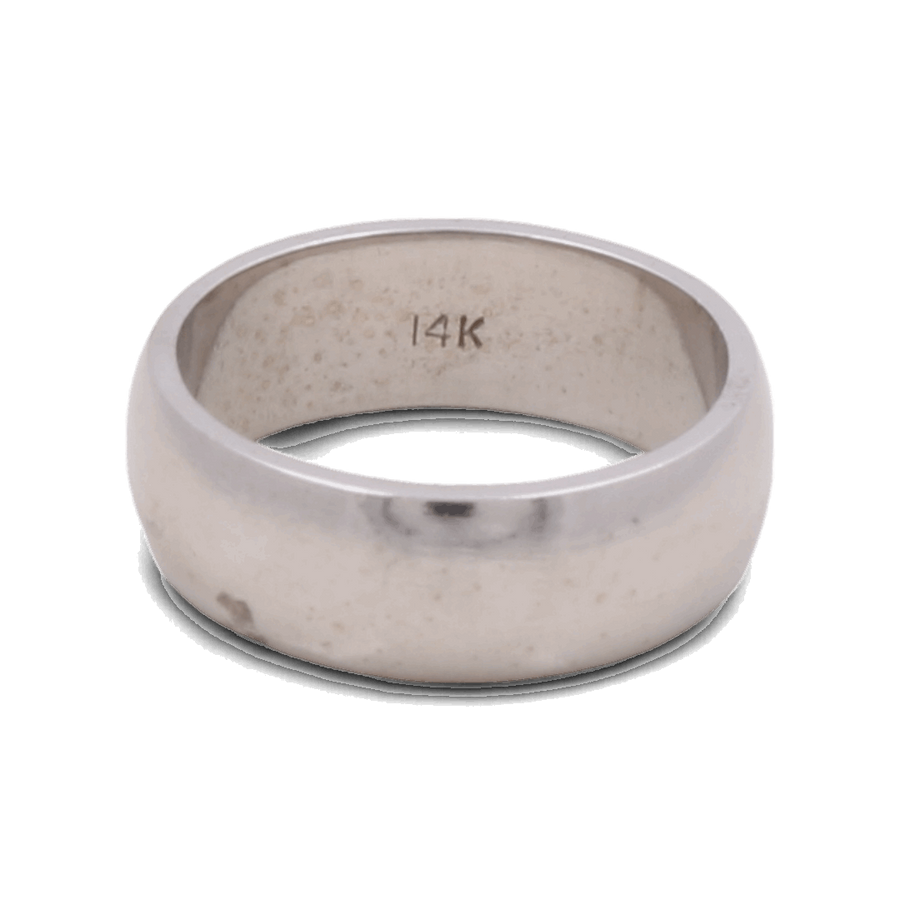 A 14K white gold men's wedding ring from Miral Jewelry with "14K" engraved on the inner side.