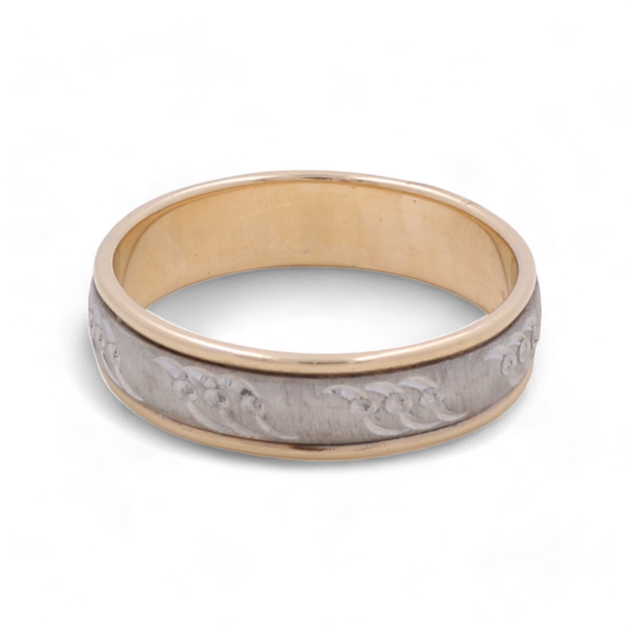 The 14K White and Yellow Gold Wedding Men Ring from Miral Jewelry boasts a sophisticated two-tone design with an intricate engraved pattern on the outer band, while the inner band remains a plain gold, enhancing its elegance.