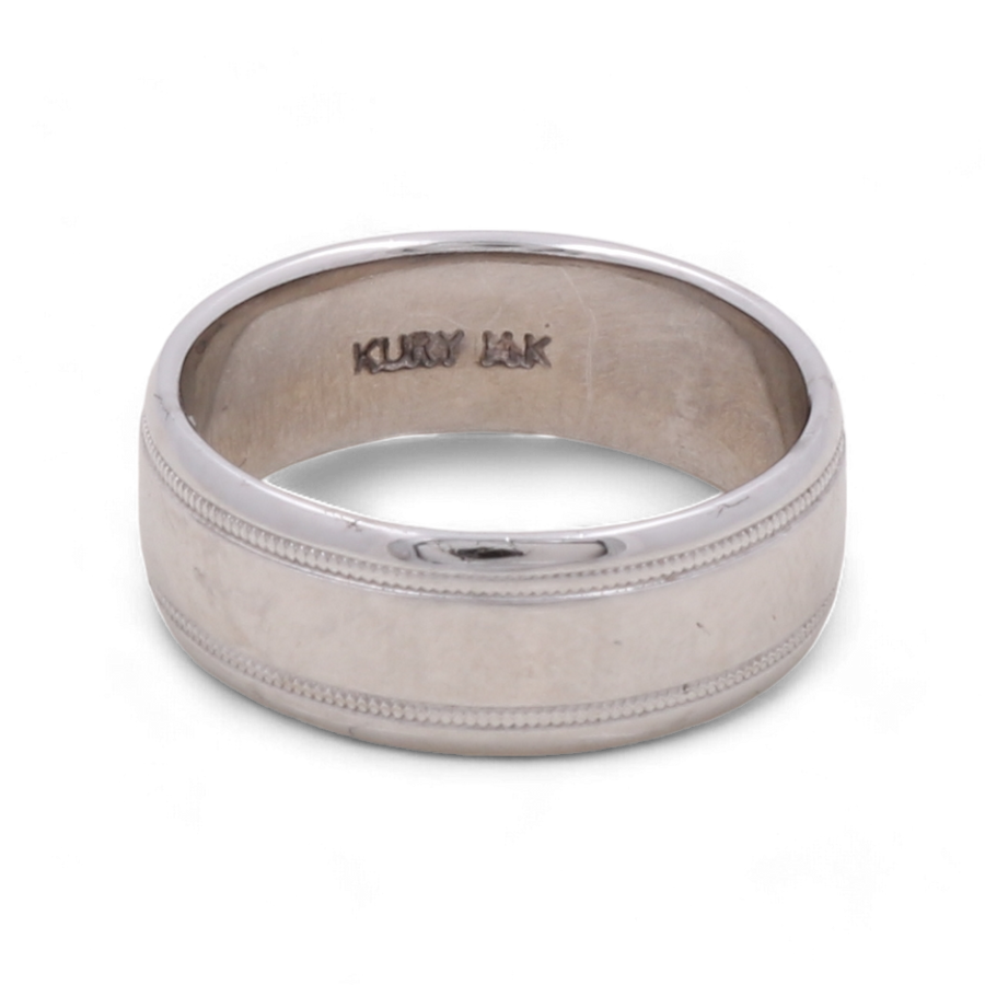 A distinguished 14K White Gold Wedding Men Ring by Miral Jewelry, featuring the engraved text "KURY IAK" on the inside. The ring boasts a smooth polished exterior complemented by a decorative band, making it an elegant selection.