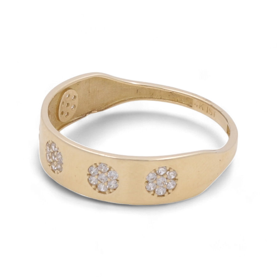 A luxurious choice, the Miral Jewelry 14K Yellow Gold Wedding Little Flowers Men Ring showcases a stunning floral design with three circular clusters of small diamonds on the band.