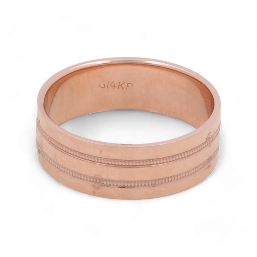 An elegant men's wedding ring in 14K rose gold from Miral Jewelry, featuring textured bands and engraved with "G14KP" on the inner surface.