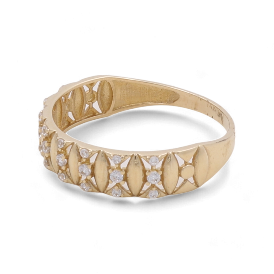 The 14K Yellow Gold Fashion Women Ring with Zirconias by Miral Jewelry is adorned with diamond-like zirconias embedded in a decorative, openwork pattern.