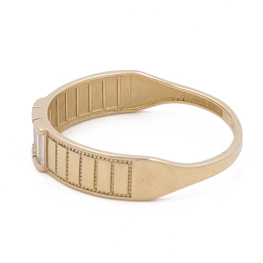 Introducing the Miral Jewelry 14K Yellow Gold Men Wedding Ring with Zirconias, featuring a rectangular clear stone setting and engraved horizontal lines on the band—an ideal choice for a men's wedding ring.