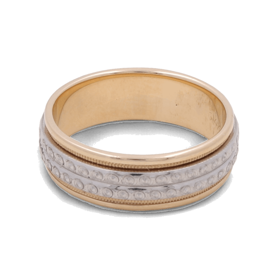 A luxurious 14K yellow and white gold wedding ring by Miral Jewelry, featuring a central white band with intricate small circular designs.