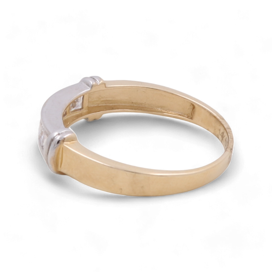 A 14K yellow and white gold wedding ring with zirconia, crafted by Miral Jewelry, features a plain, unadorned band that is elegantly complemented by its white metal setting when viewed from the side.