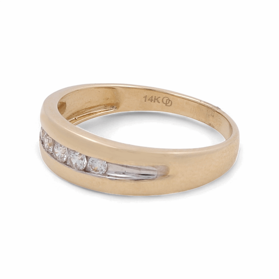 The 14K Yellow and White Gold Fashion Men Ring with Zirconia by Miral Jewelry is a striking piece, crafted from 14K yellow and white gold, and features a row of sparkling zirconia stones set in the band.