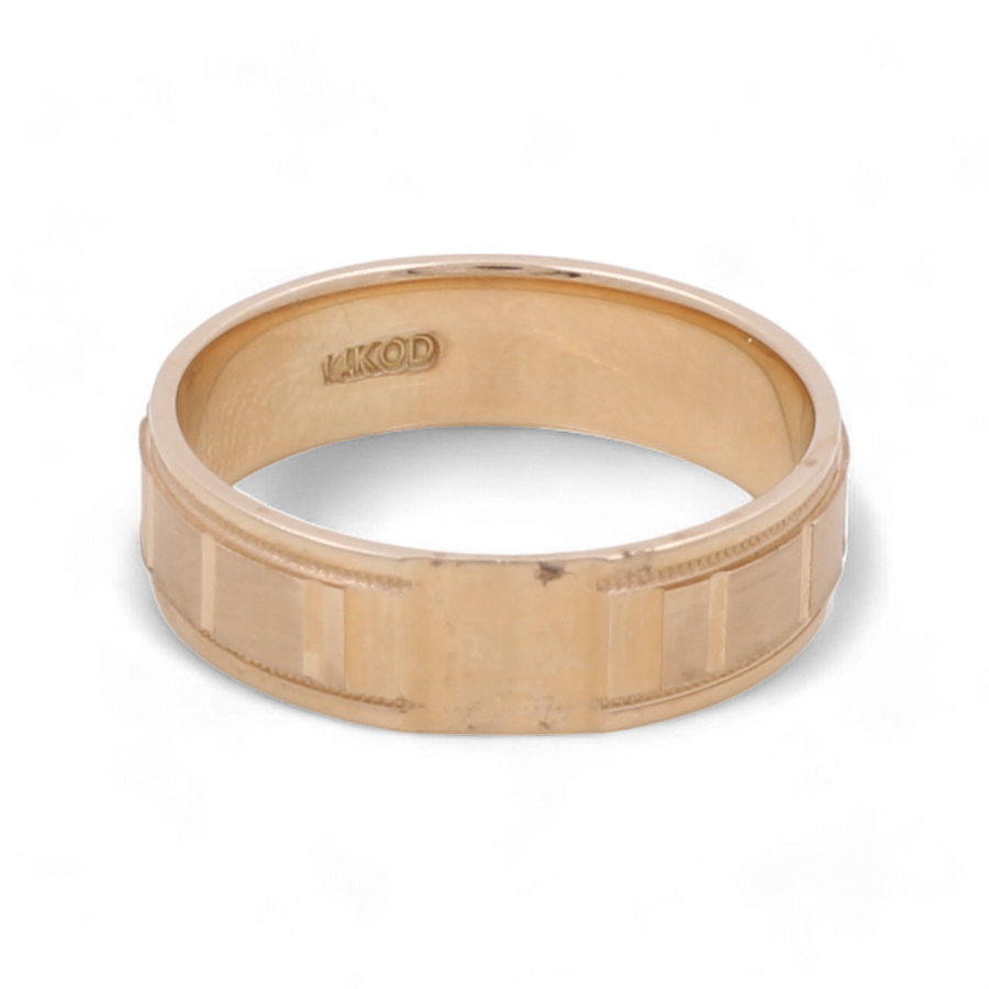 Introducing the Miral Jewelry 14K Yellow Gold Wedding Band Men Ring: a distinguished men's wedding band featuring an engraved pattern and the inner band marked with "14KOD.