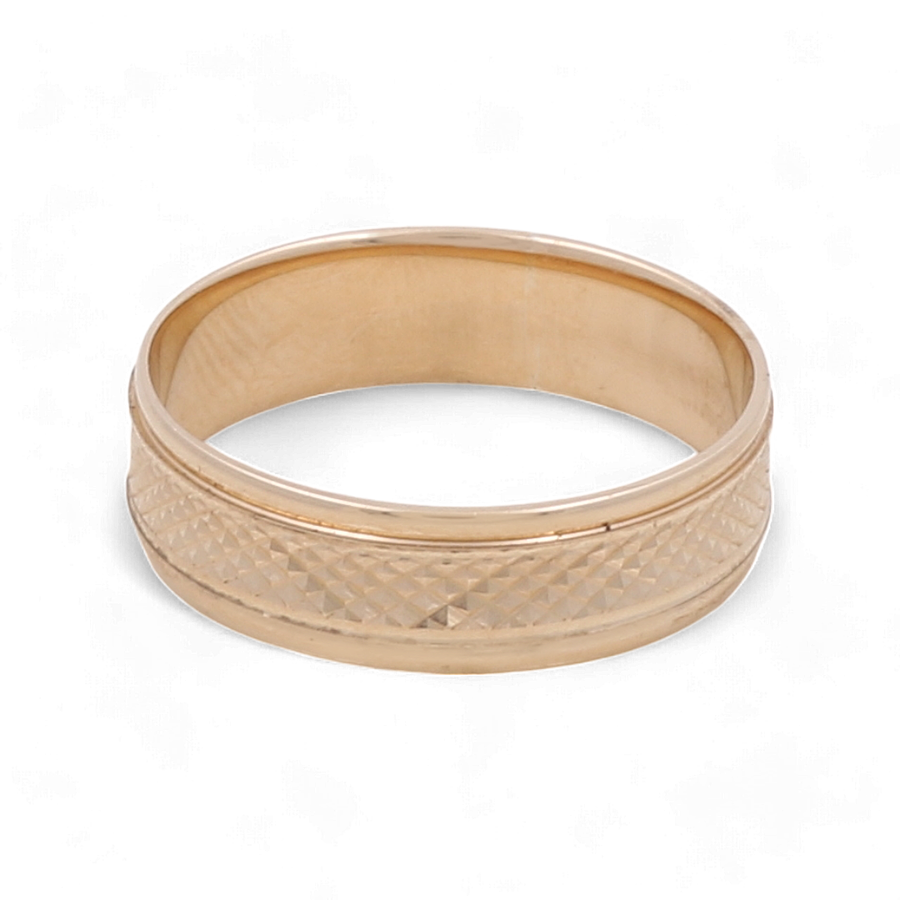 The Miral Jewelry 14K Yellow Gold Wedding Band Men Ring features a textured, diamond-patterned center with smooth edges, making it a perfect choice for men.