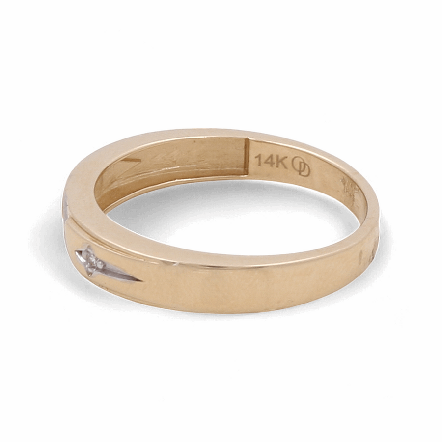 The Miral Jewelry 14K Yellow and White Gold Wedding Band for men features a simple band design accented with a small zirconia.