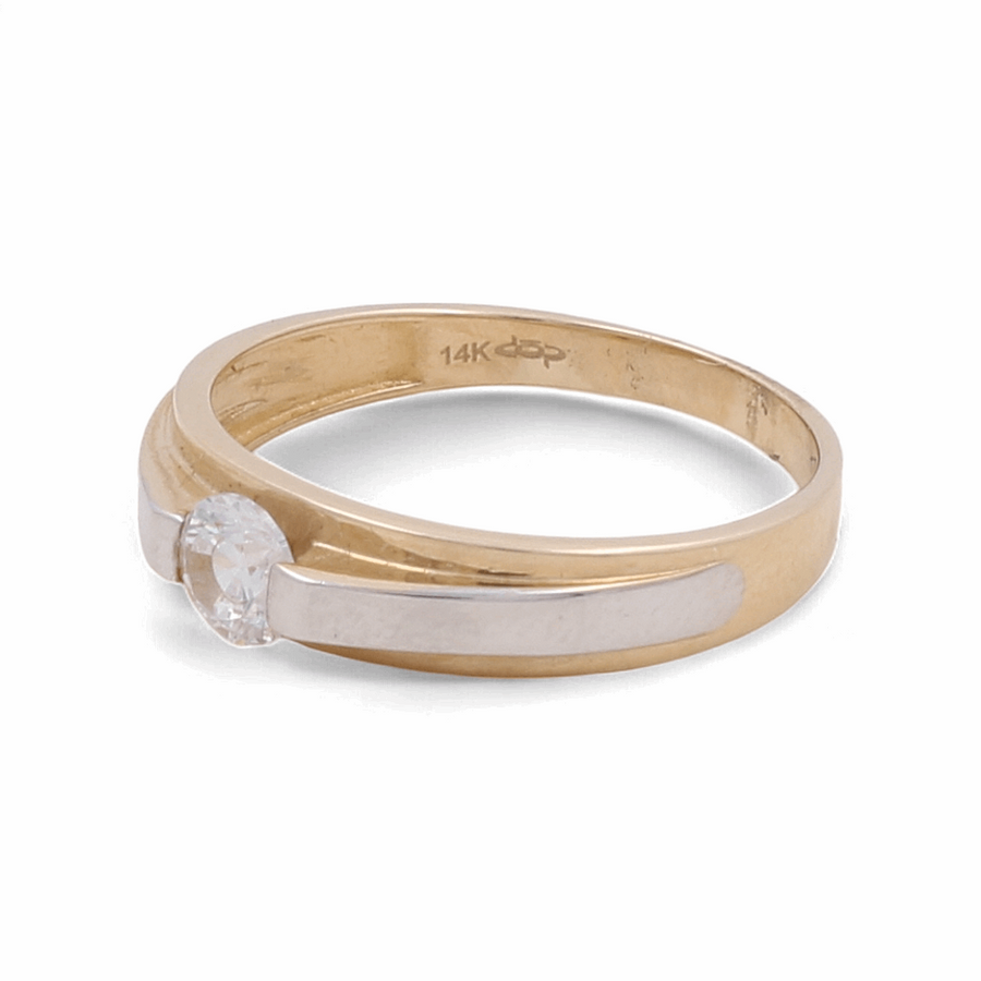 This 14K yellow and white gold women's ring from Miral Jewelry features a zirconia stone set in the center.