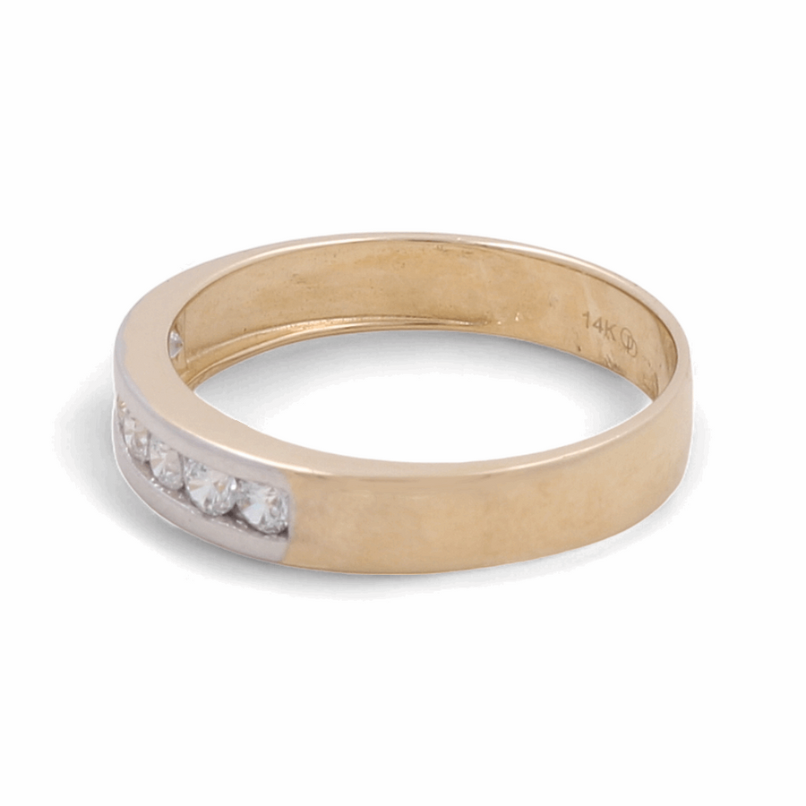 The 14K yellow and white gold wedding men's ring from Miral Jewelry is adorned with elegant zirconia accents.