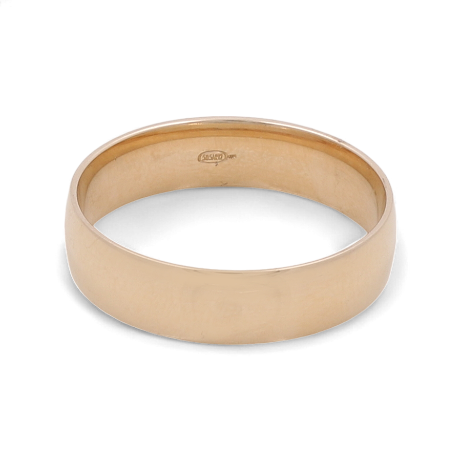 A plain men's wedding band from Miral Jewelry, made of 14K yellow gold with a smooth finish and hallmark engraving on the inside.