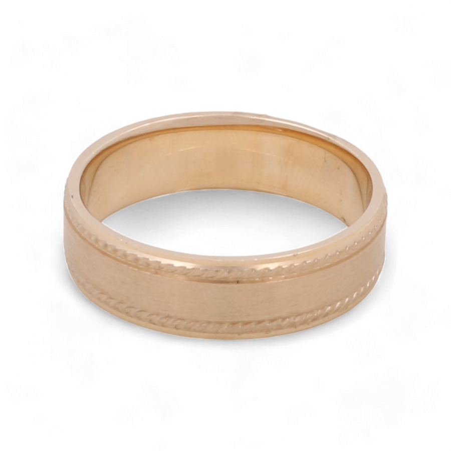 The 14K Yellow Gold Wedding Band Men Ring by Miral Jewelry features a simple design with a narrow decorative border around the middle.