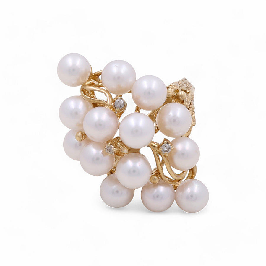 The Miral Jewelry 14K Yellow Gold Fashion Women's with Pearl Ring showcases a cluster of white pearls and small diamond accents in an elegant design, making it the perfect addition to women's fashion accessories.