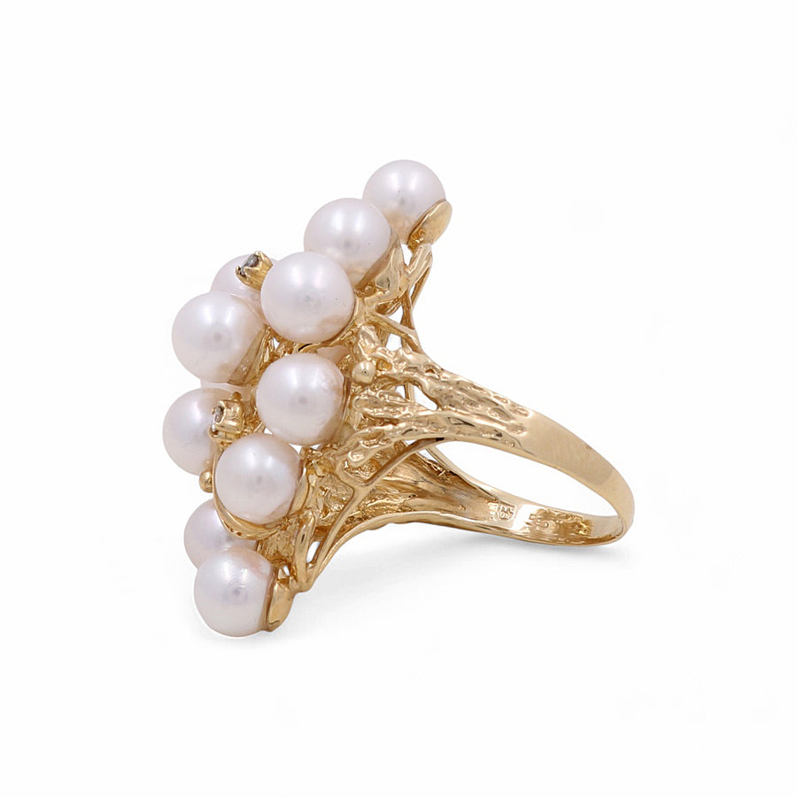 This exquisite 14K Yellow Gold Fashion Women's with Pearl Ring from Miral Jewelry features a stunning cluster of multiple white pearls.