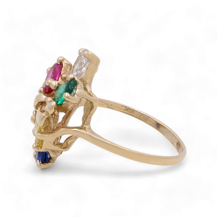 The 14K Yellow Gold Fashion Women Ring with Stones by Miral Jewelry showcases a stunning array of red, green, blue, and clear gemstones set in an intricate design, complemented by sparkling zirconia.