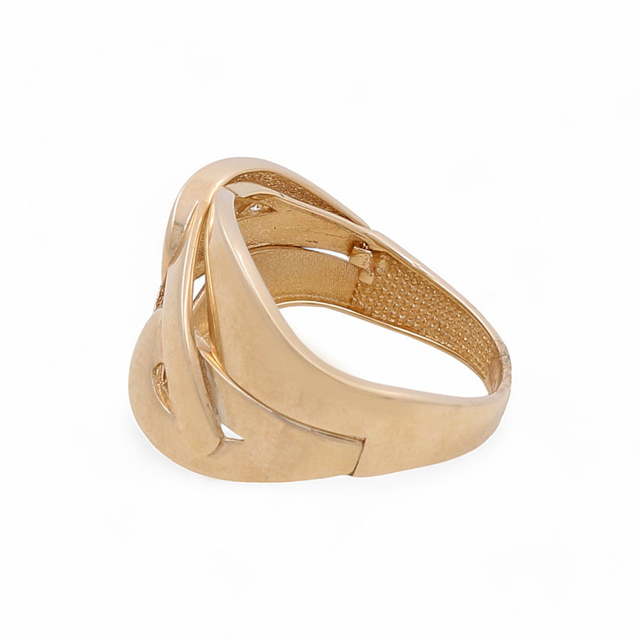 The 14K Yellow Gold Fashion Women's Ring by Miral Jewelry showcases a smooth, abstract design with intricate cut-out shapes and a matte finish. Crafted from polished 14K yellow gold, this broad band is also adorned with delicate cubic zirconias for an added touch of elegance.