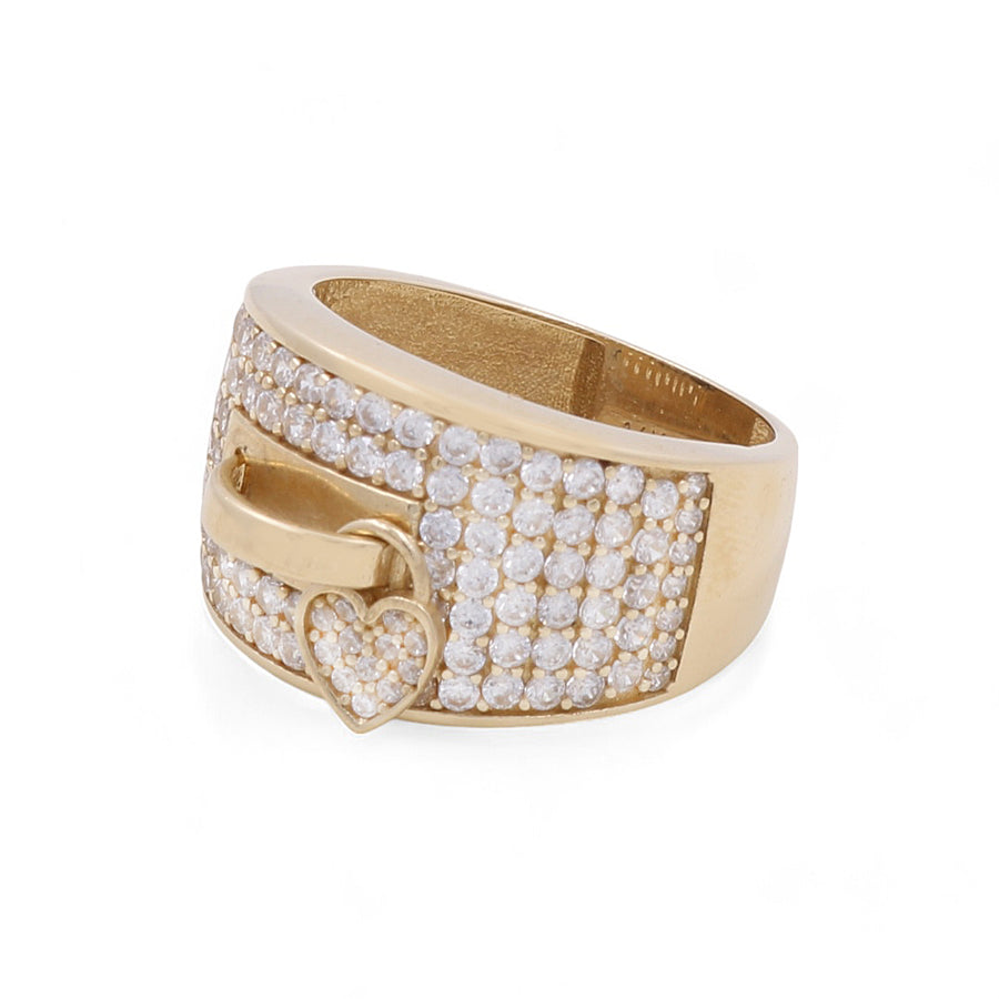 A Miral Jewelry 14K Yellow Gold Fashion Women's Ring with a wide band adorned with small round cubic zirconias. The design features a small heart charm, also encrusted with cubic zirconias.