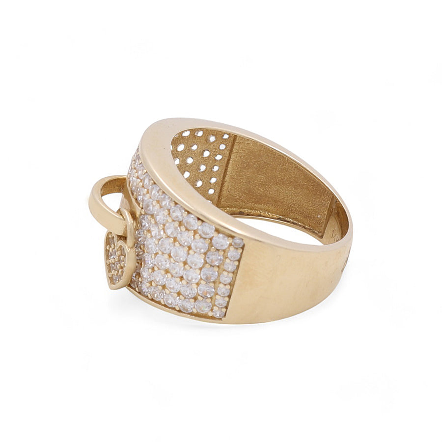 The 14K Yellow Gold Fashion Women's Ring with Cubic Zirconias from Miral Jewelry boasts a wide band adorned with a pave setting of small cubic zirconia diamonds on the front and includes a delicate heart-shaped charm, exuding unparalleled elegance and charm.