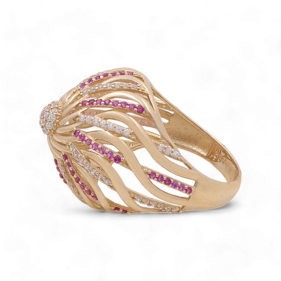 The Miral Jewelry 14K Yellow Gold Fashion Women Ring boasts a wave-like design, adorned with alternating rows of small red and white zirconia stones.