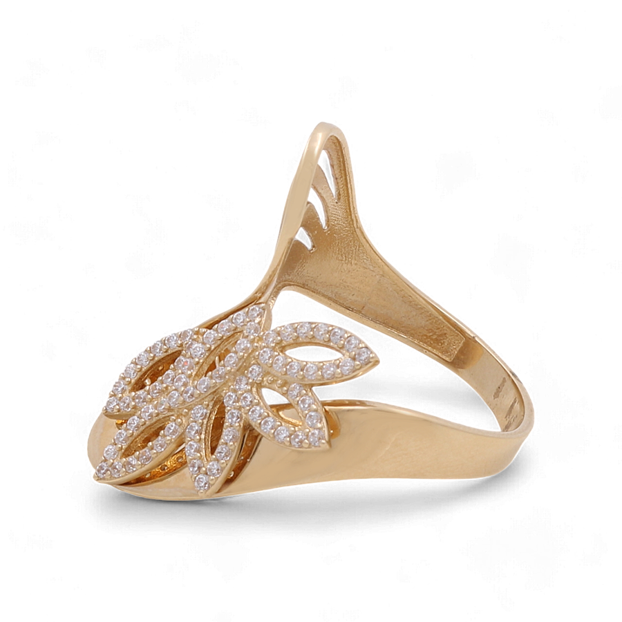 The 14K Yellow Gold Fashion Women Ring by Miral Jewelry features an ornate, leaf-shaped design adorned with small cubic zirconia stones and showcases intricate openwork details.